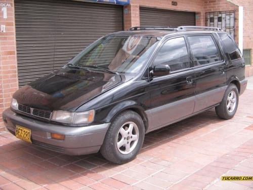 Photo of a 1994 Mitsubishi Expo in Albany Black Pearl on Kensington Gray (paint color code J1H