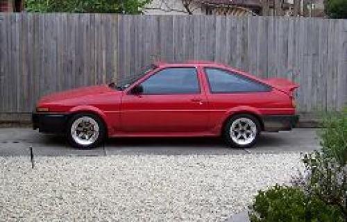 Photo of a 1985-1988 Toyota Corolla in Red<br>(AKA Black(2T6:3E6|202)) (paint color code 3E6