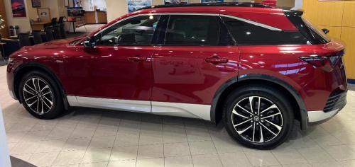 Photo of a 2024 Acura ZDX in Scarlet Red Metallic (paint color code 170H)