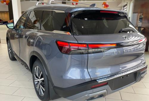 Photo of a 2022 Infiniti QX60 in Moonbow Blue (paint color code XJU)