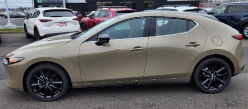 Photo of a 2024-2025 Mazda 3 in Zircon Sand Metallic (paint color code 48T)