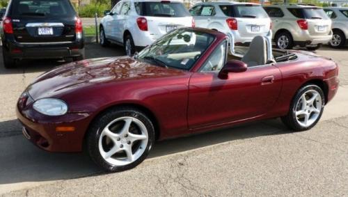 Photo of a 2003 Mazda Miata in Garnet Red Mica (paint color code 25F)