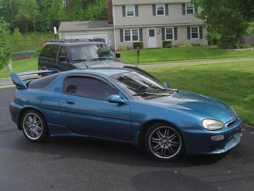 Photo of a 1992 Mazda MX-3 in Tropic Emerald Metallic (paint color code Z1)