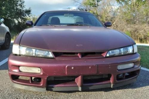 Photo of a 1997 Nissan 240SX in Deep Fuchsia (paint color code LS1)