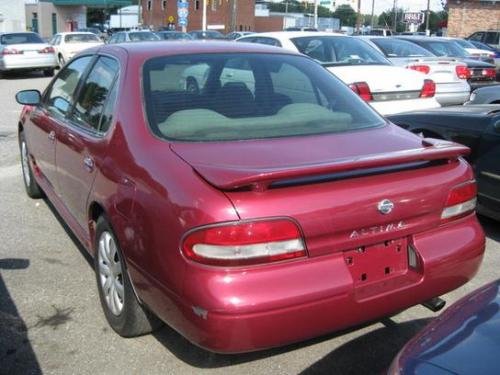 Photo of a 1997 Nissan Altima in Ruby Pearl (paint color code AL0
