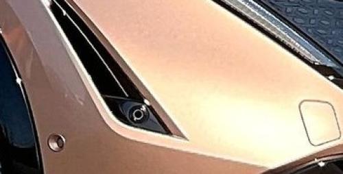 Photo of a 2023-2025 Nissan Ariya in Sunrise Copper Pearl (paint color code XGJ)