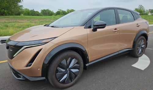 Photo of a 2023-2024 Nissan Ariya in Black Diamond Pearl on Sunrise Copper Pearl (paint color code XGJ)