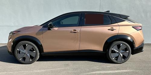 Photo of a 2023-2024 Nissan Ariya in Black Diamond Pearl on Sunrise Copper Pearl (paint color code XGJ)