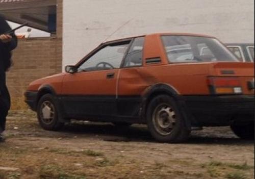Photo of a 1986 Nissan Pulsar in Regatta Red Metallic on Thunder Black (paint color code 064)