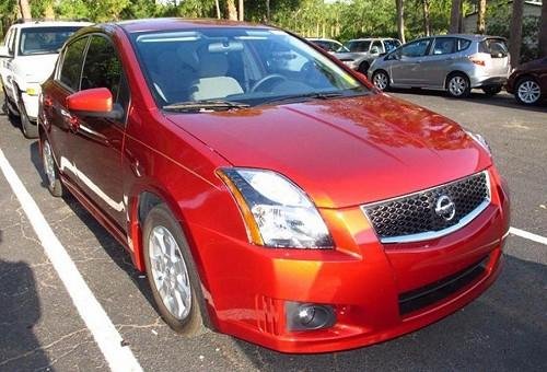 Photo of a 2010-2011 Nissan Sentra in Lava Red (AKA Anodized Orange) (paint color code EAF)