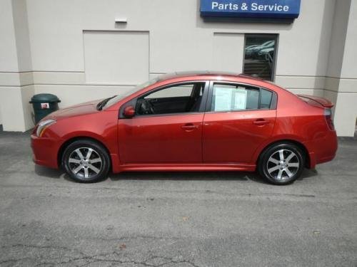 Photo of a 2010-2011 Nissan Sentra in Lava Red (AKA Anodized Orange) (paint color code EAF)