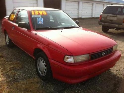 Photo of a 1994 Nissan Sentra in Aztec Red (paint color code AG2