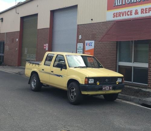 Photo of a 1986.5 Nissan Truck in Butter Yellow (paint color code 119)