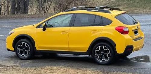 Photo of a 2015 Subaru Impreza in Sunrise Yellow (paint color code C2Z)