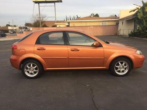 Photo of a 2005 Suzuki Reno in Sunburst Metallic (paint color code 54U)