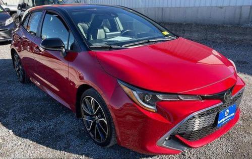 Photo of a 2021 Toyota Corolla in Midnight Black on Supersonic Red (paint color code 2SC)